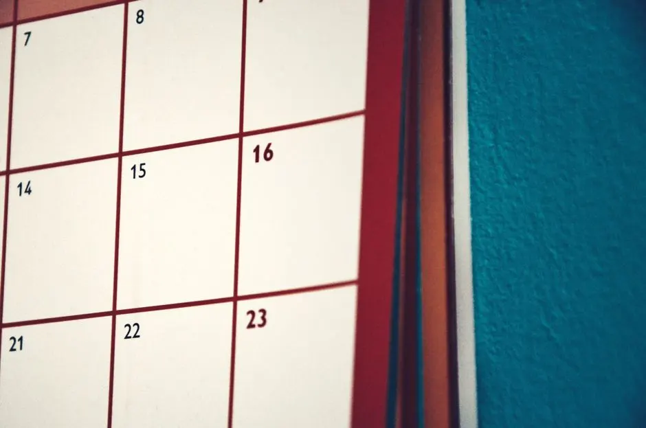 A minimalist calendar hanging on a colorful wall, perfect for planning and organization.